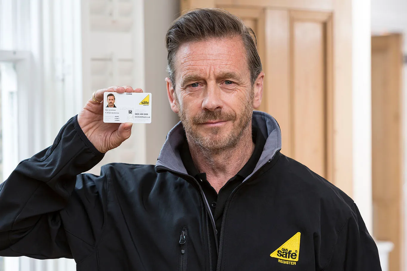 Gas Safe registered engineer showing ID card on arrival